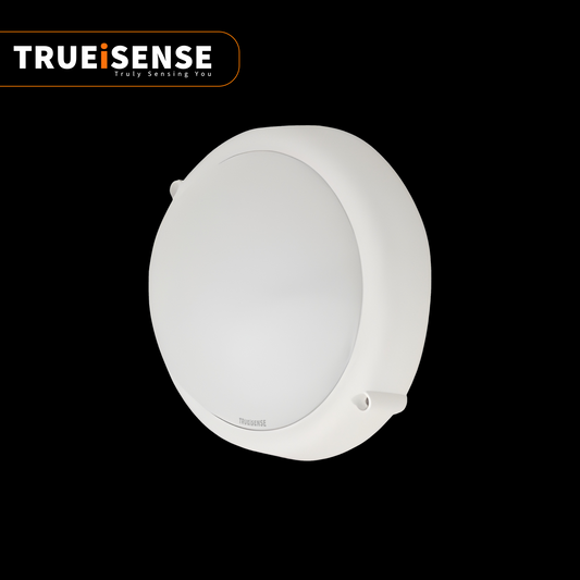 Round white sensor device with 'Trueisense' branding on a black background, motion sensor bulkhead light, auto on/off bulkhead light, motion sensor bulkhead light, true presence sensor, breathing sensor, real presence sensor